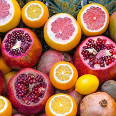 a mix of pomegranates, oranges and blood oranges